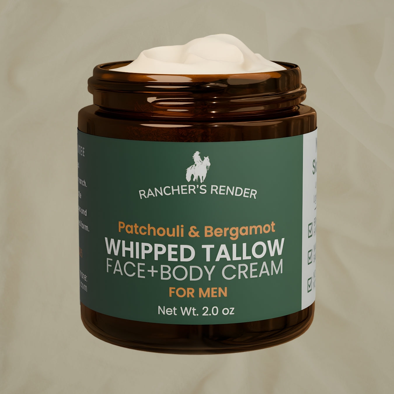 Jar of Rancher's Render whipped tallow face and body cream with a green label on a beige background